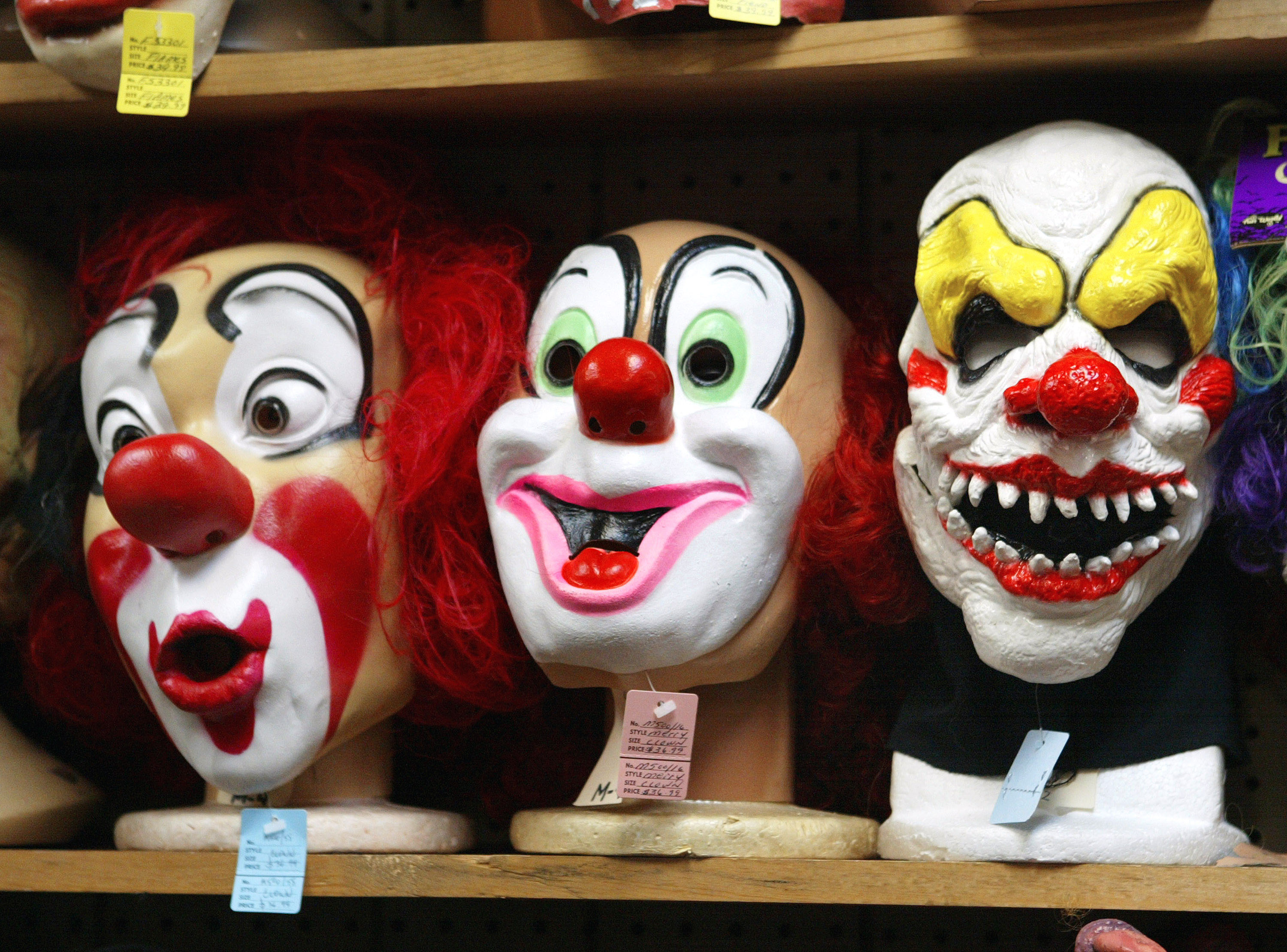 CHICAGO - OCTOBER 17:  Clown masks are displayed at the Fantasy Costumes HDQ. store October 17, 2003 in Chicago, Illinois. Halloween, the day normally observed with dressing up in disguise, trick-or-treating, and displaying jack-o-lanterns during the evening is only two weeks away on October 31.  (Photo by Tim Boyle/Getty Images)